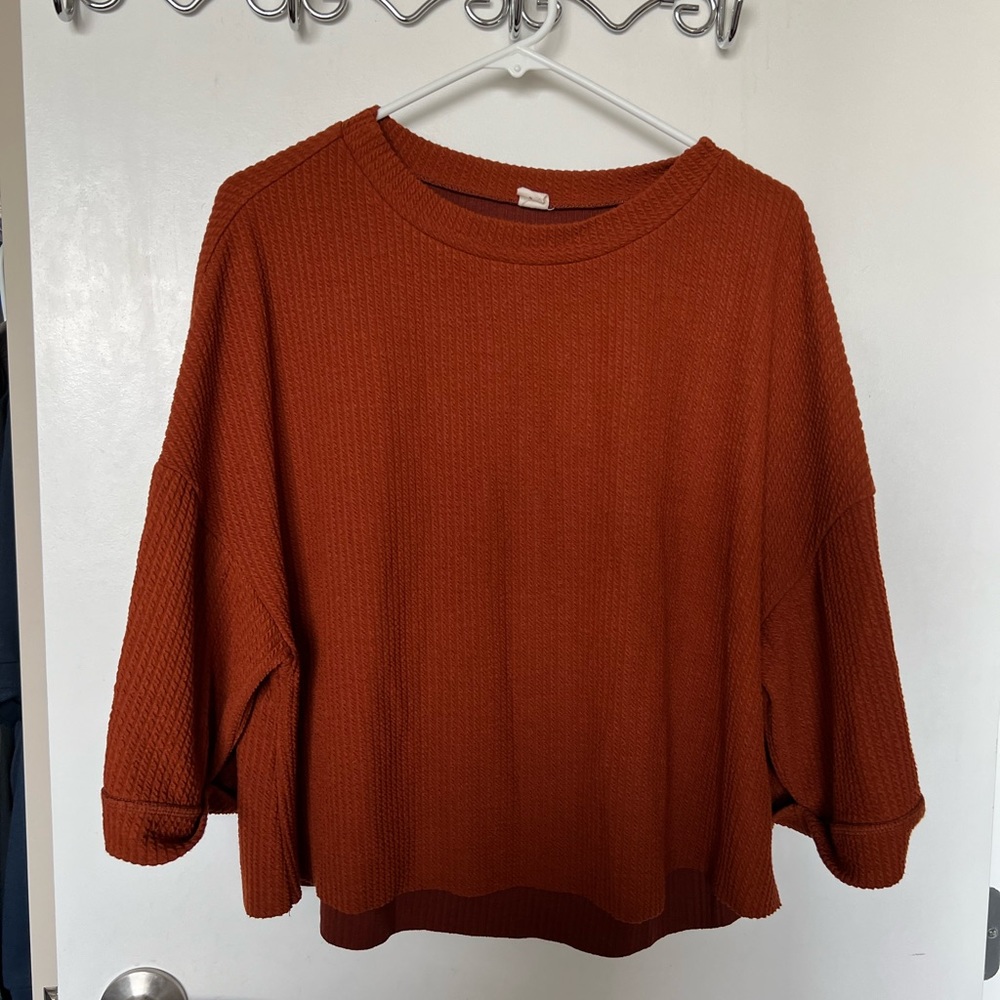 Worn once orange top from Salty.